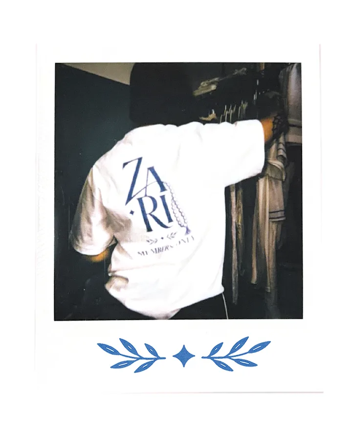 The back print again, seen from behind with an arm raised.