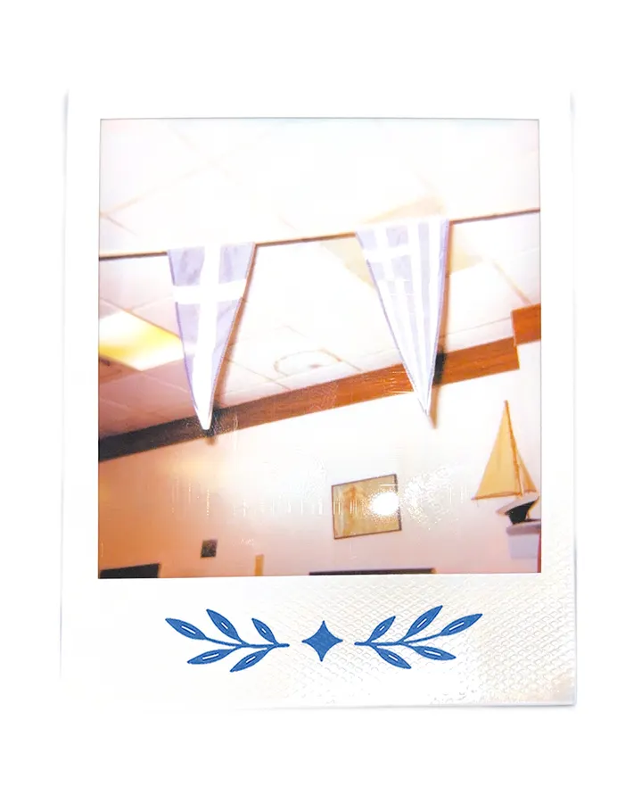 Blue and white pennants strung across the studio ceiling.